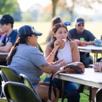 Families enjoying food on Kirkhof Lawn.